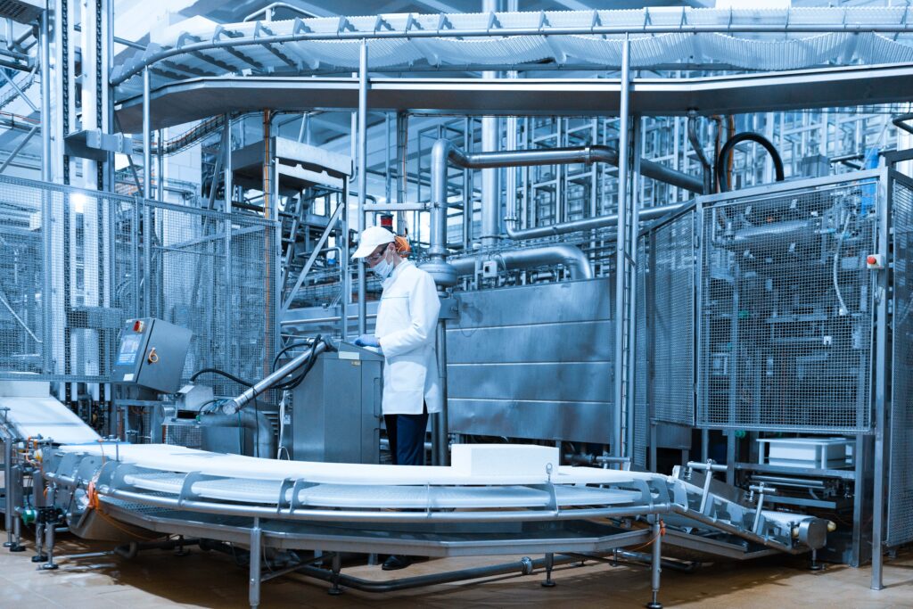 technologist-make-set-up-production-line-while-standing-near-digital-screen-department-dairy-factory-min